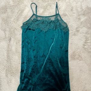 Green, velvet, spaghetti strap, mini dress with lace detailing.